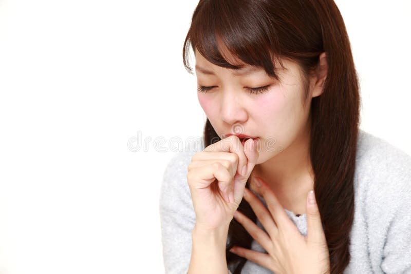 Jonge Japanse vrouw coughing  royalty-vrije stock afbeelding Jonge Japanse vrouw coughing  royalty-vrije stock afbeelding